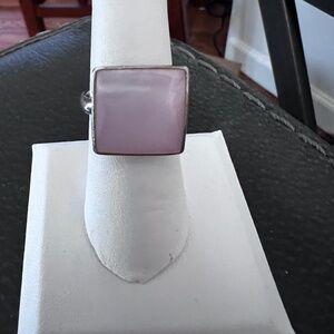 Sterling silver 925  mother of Pearl Ring it is about a half inch wide.